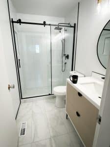 bathroom with framed shower doors